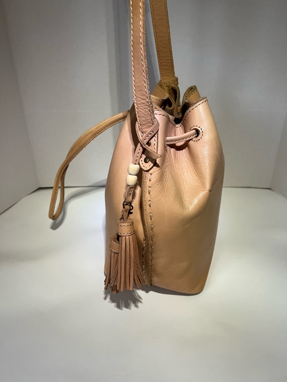 The Sak Beige/Tan Woven Drawstring Bucket Crossbody with Tassel - Picture 4 of 5